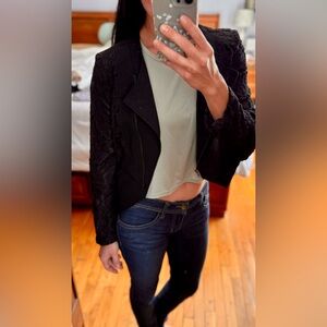 Black jacket with lace accent.